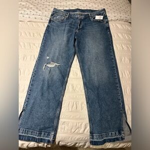 Gap blue jeans, never worn. Mid rise, 90s loose style with boot slit.